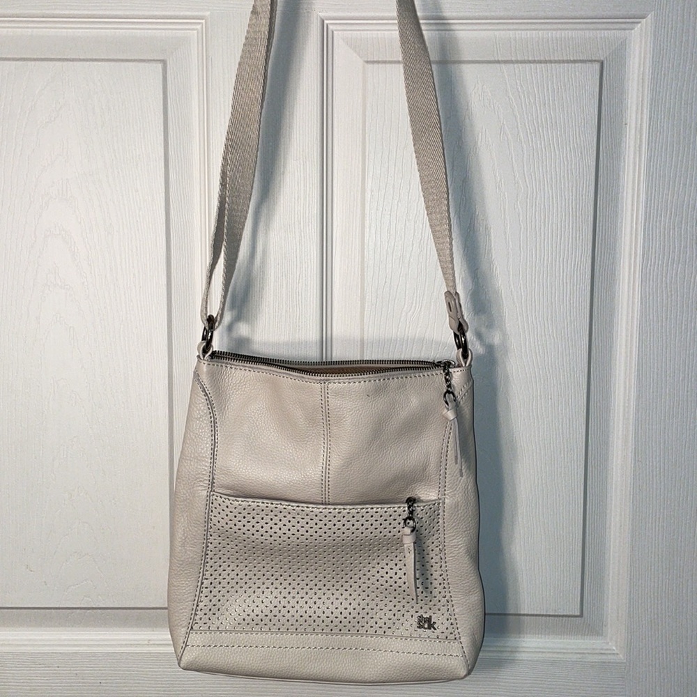 The Sak stone perforated crossbody leather handbag